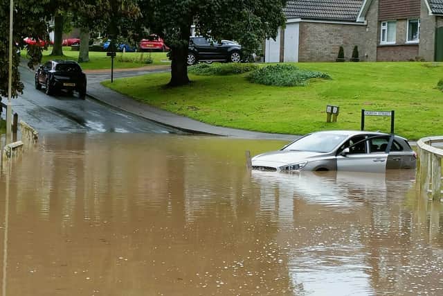 Car marooned in flood water in Scalby, near Scarborough, this morning.