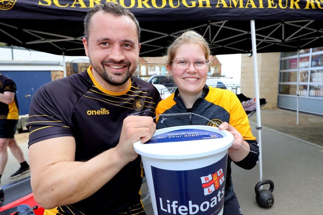 Duncan Raynor and Megan Wilson collect the donations