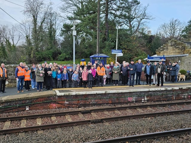 A large crowd gathered at the station to pay tribute to Mr Norris