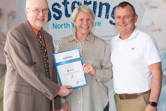 Foster carers John and Karen Pownall with North Yorkshire Council’s placement and fostering manager, Alan Tucker, at an annual conference earlier this year after being recognised for the rewarding work they do.