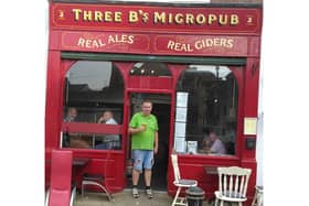 Mark Bates, owner of the award winning Three B's Micropub, celebrating their most recent award with a well-deserved pint.