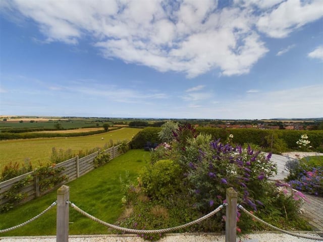 Gardens with open views.