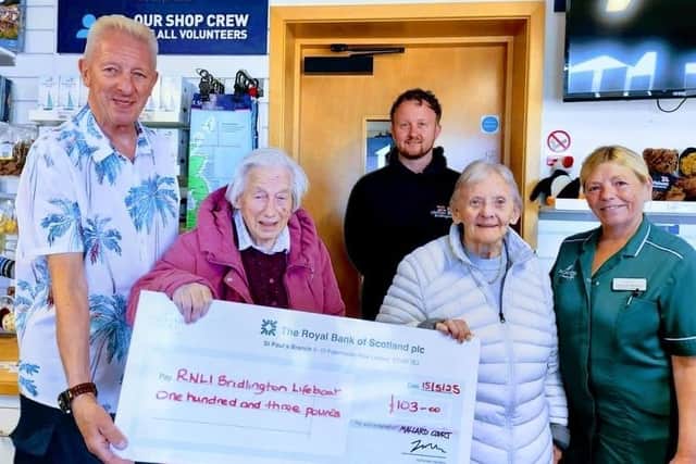 Residents and staff recently visited their local RNLI shop to present a cheque to the team.