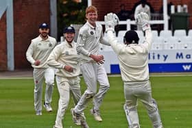 Scarborough spinner Clarke Doughney jumps for joy with a wicket with his first ball of the day.