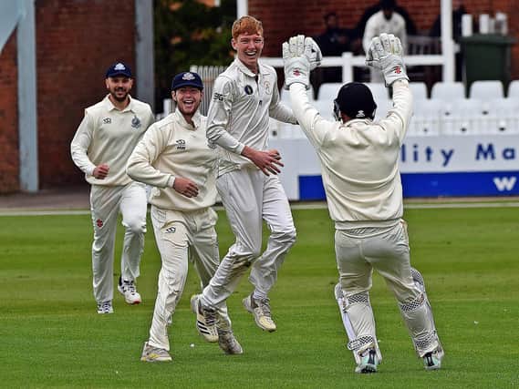 Scarborough spinner Clarke Doughney jumps for joy with a wicket with his first ball of the day.