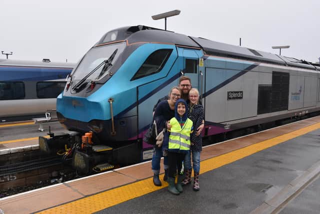 Ernie and his family with the locomotive.