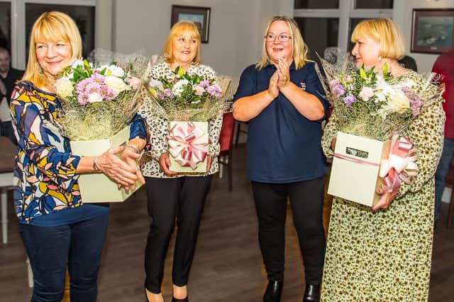 Gail Batty presenting flowers to Linda Wood, Janet Clark and Julie Lodge. Photo courtesy of Rod Newton/RNLI.
