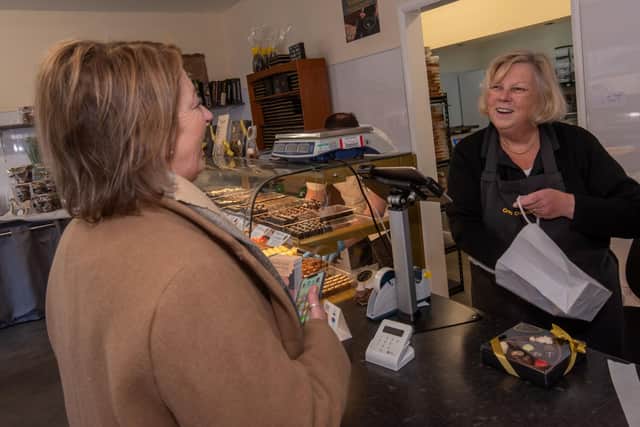 Sheila Grant serving a customer at Crofts Chocolates, Scarborough.