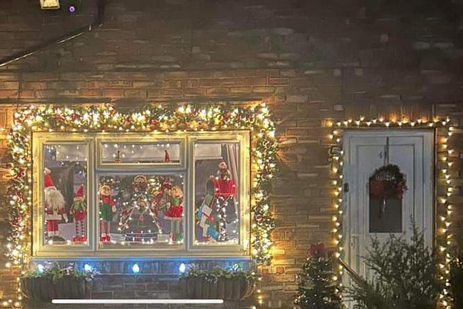 This Scarborough home has some beautiful glittering lights on display and some festive fun in the window.