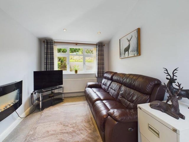This second reception room is currently used as a snug, but could easily be a home office or bedroom.