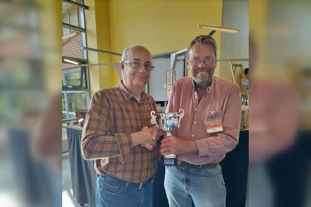 Peter Goss being presented a trophy for his Copper Wort layout by Trainshed Chairman Mike Brayshaw.
