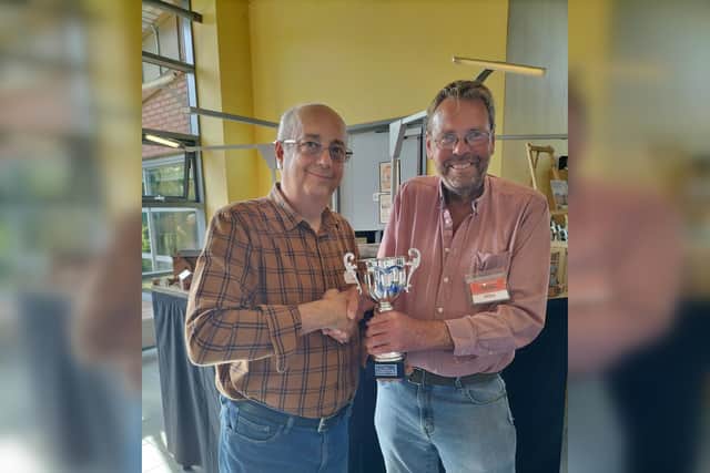 Peter Goss being presented a trophy for his Copper Wort layout by Trainshed Chairman Mike Brayshaw.