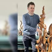 Auctioneer Will Duggleby with a large Skelton wall sculpture.
