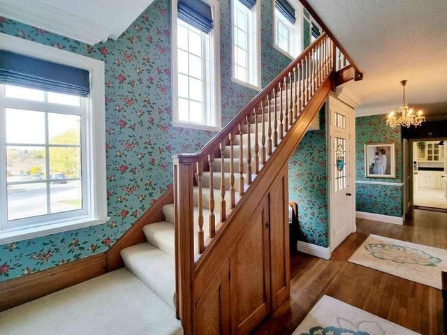 An impressive hallway with multiple windows.
