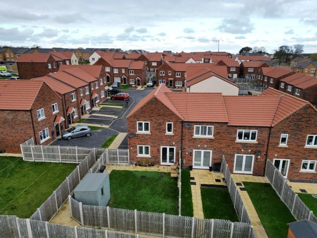 An overview showing the rear of the three bedroom property with its south-facing rear garden.