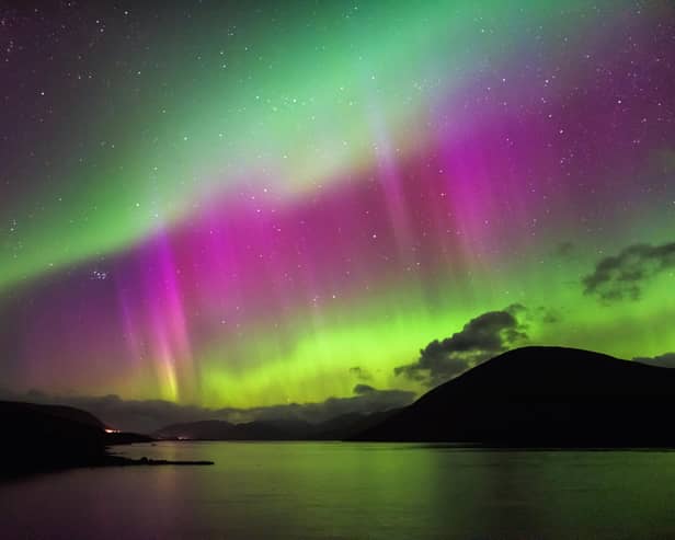 Aurora Borealis, also known as the Northern Lights, putting a show on dancing over Loch Glascarnoch, by Garve, in the Highlands