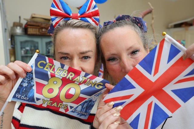 Sarah and Sarah with their flags.