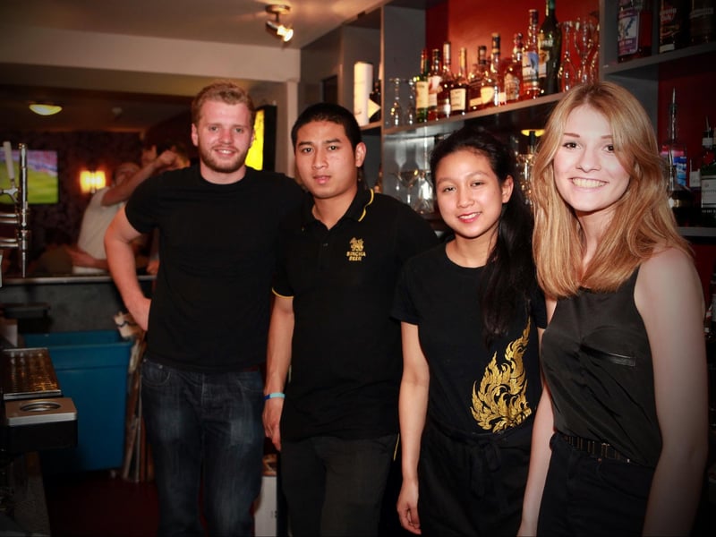 Lawrence, Mark, Min and Beth serving the punters in Tui's cocktail bar.
142431a