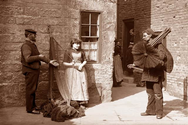 Chimney Sweep – William Bachelor the sweep talks to fisherfolk in this Sutcliffe photo.
Picture by permission of Whitby Literary and Philosophical Society