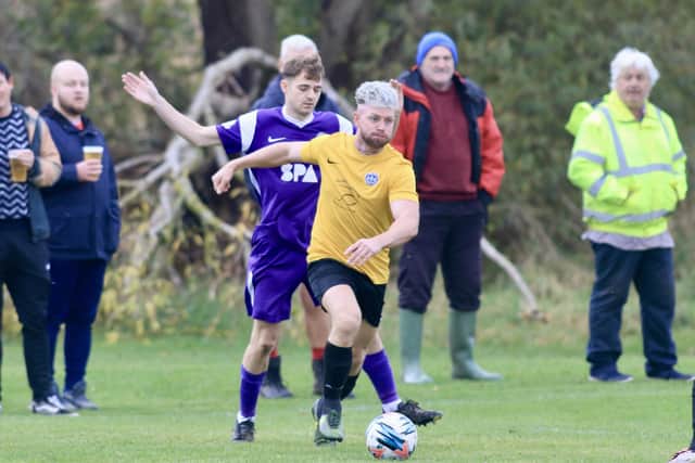 Flamborough, yellow shirts, on the attack against Brid Spa. Photos by TCF Photography