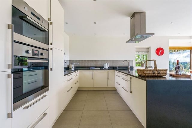 The high spec kitchen is part of an open plan design with relaxed and dining areas.