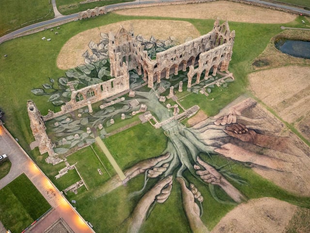 Aerial views of a 5,400 square metre land-art installation created by MTArt artist David Popa as it is unveiled at Whitby Abbey, paying homage to seven Heritage ‘Game Changers’ from across the UK.