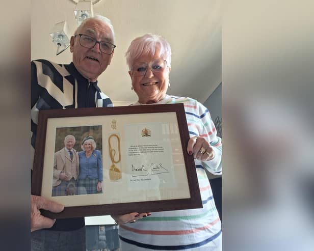 Jenny and Roy Baldwin with their congratulatory message from the King.