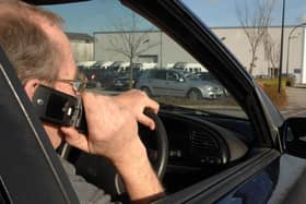 Home Office figures show North Yorkshire Police handed out 691 fixed penalty notices to people for driving while using a hand-held device in 2022 (picture posed by model).Photo: Press Association