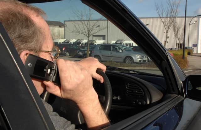 Home Office figures show North Yorkshire Police handed out 691 fixed penalty notices to people for driving while using a hand-held device in 2022 (picture posed by model).Photo: Press Association