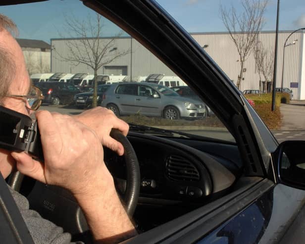 Home Office figures show North Yorkshire Police handed out 691 fixed penalty notices to people for driving while using a hand-held device in 2022 (picture posed by model).Photo: Press Association