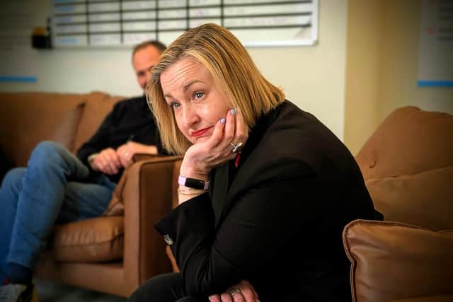 Alison listening to residents as they tell their stories.