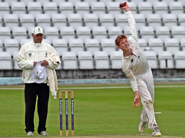 Scarborough spinner Clarke Doughney wheels away.