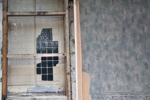 A hidden window and old wallpaper uncovered during renovations