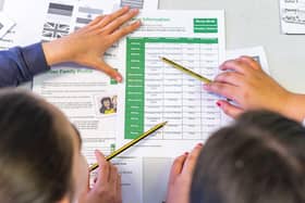 Children complete activities during a Money Minds lesson from Yorkshire Building Society.
