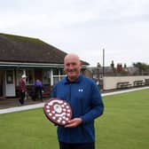 Alan Landers with the Champions of Champions trophy.