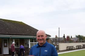 Alan Landers with the Champions of Champions trophy.