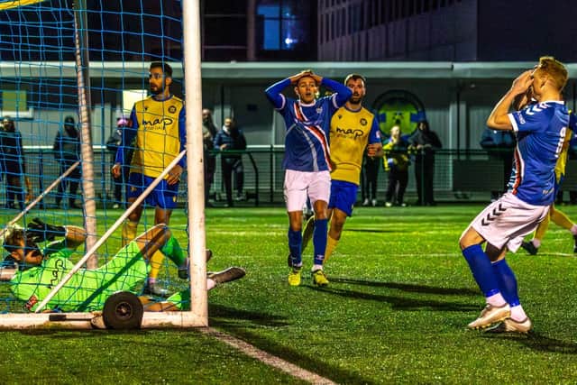 Whitby Town forward Jake Charles with Michael Woods after the latter missed a sitter in the goalless draw at Stockton Town. Photo by Brian Murfield