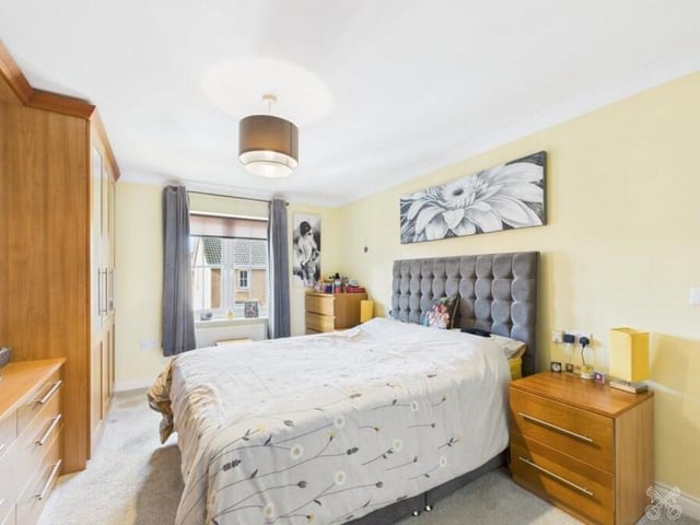 This double room with fitted furniture is one of five bedrooms.