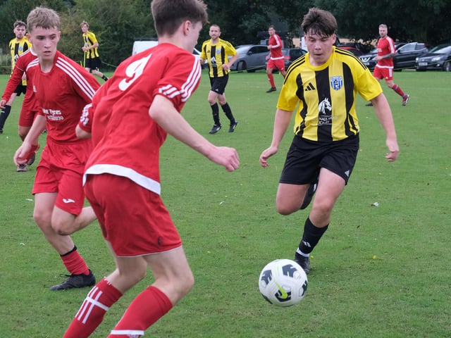 Scalby, yellow and black kit, close down Richmond Academy in the cup clash.