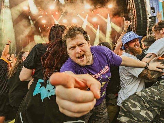 Fans rocking out at the gig.