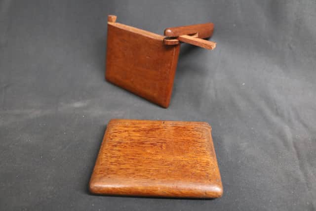 A number of wooden cigarette cases that were likely handcrafted by prisoners of war were also donated.