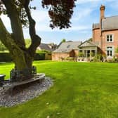 A view of the country home from its extensive rear garden.