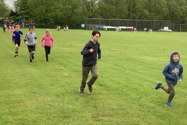 Snainton School youngsters complete laps of the school field for Motor Neurone Disease Association.