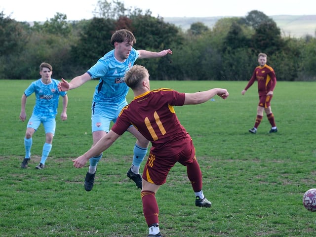 Seamer, blue kit, and Haltemprice, slug it out. Photo by Richard Ponter