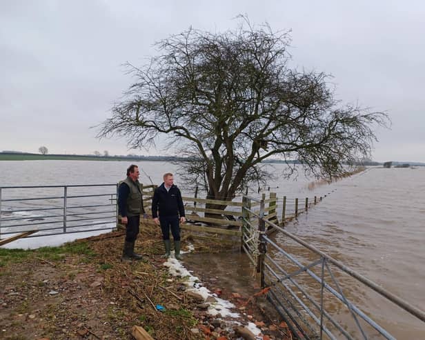 Robbie Moore MP with farmer Nigel Watson. Photo courtesy of NFU.