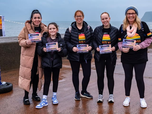 Happy walkers having completed the seafront stroll.