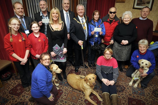 Festive Spectacular cheque presentation at The Mayors Parlour for Guide Dogs for the blind and Faith in Scarborough Schools. Presentations made by Mayor and Mayoress Andrew and Sue Backhouse, along with representatives from Newby and Scalby School  and organiser Nigel Wood in 2014.