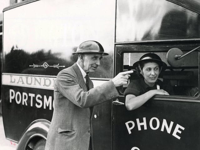 An ambulance driver gets directions in a requisitioned laundry van at Cosham in 1939. The News PP530