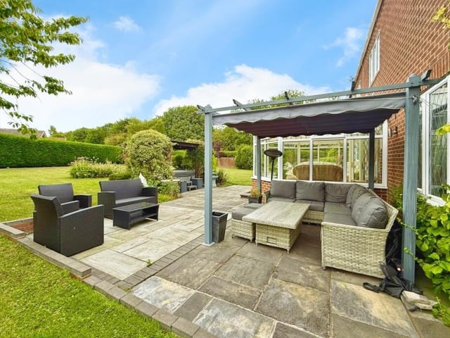 A view of the private garden with seating area.