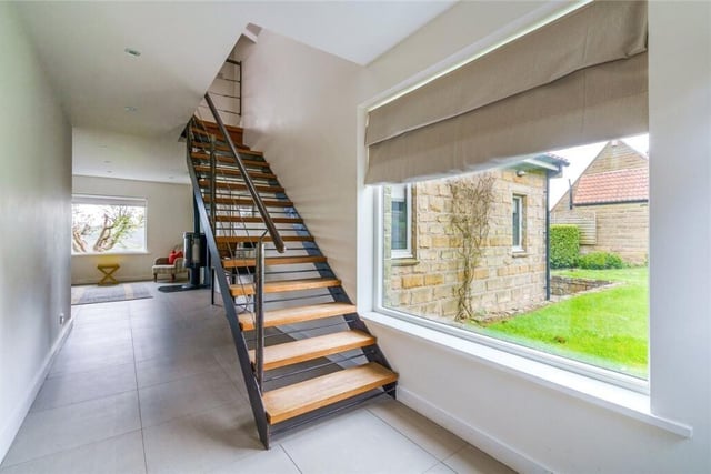 This bespoke staircase leads from the hallway to a gallery landing.